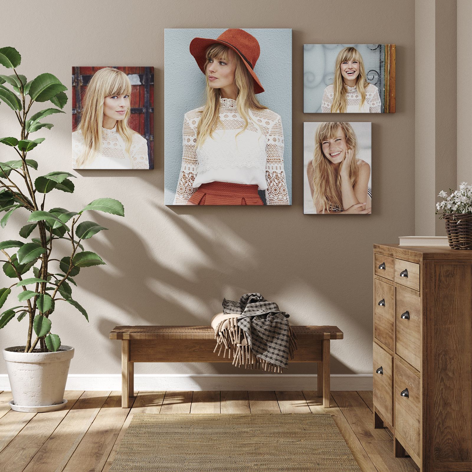 Four canvas portraits of a woman in a red hat above a rustic bench, beside a fiddle-leaf fig and a wooden chest.